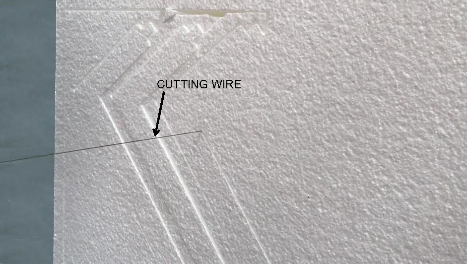 Close-up of hot wire cutting a polystyrene block